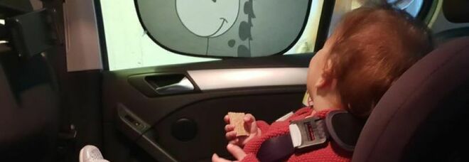 Bambina di sei mesi chiusa in auto sotto al sole, carabiniere sfonda il finestrino e la salva